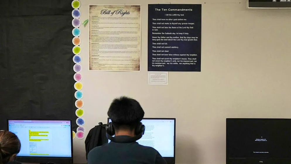 In a high school classroom in Texas, the Ten Commandments hang on the wall next to the Certificate of Freedom. (October 16, 2025)