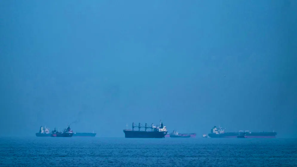 ARCHIVE - Oil tankers and cargo ships line up in the Strait of Hormuz, seen from Khor Fakkan. A container ship came under fire in the Strait of Hormuz and was badly damaged. Photo: Altaf Qadri/AP/dpa