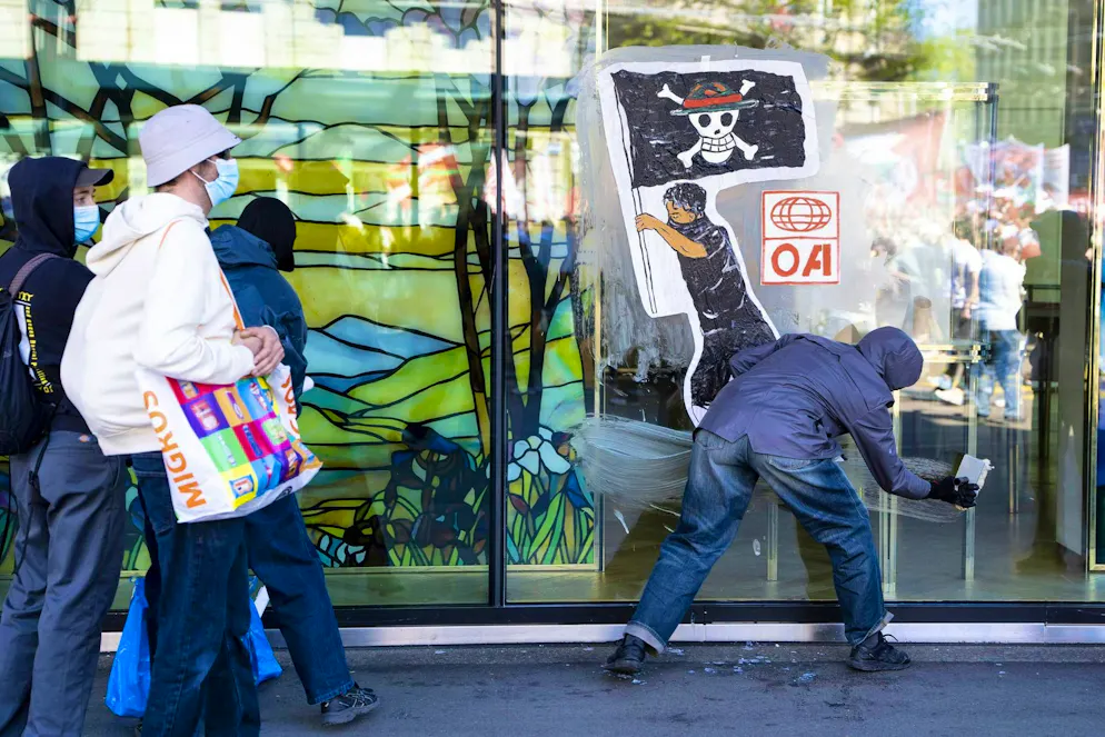 May 1, 2026. Demonstrators spray-painting a façade during the May Day demonstration.