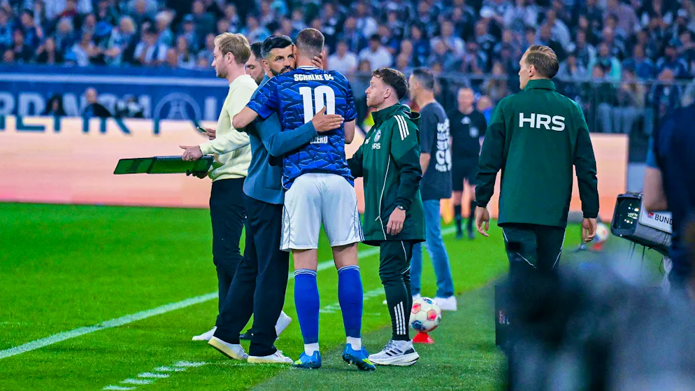 Coach Miron Muslic hugs Edin Dzeko.