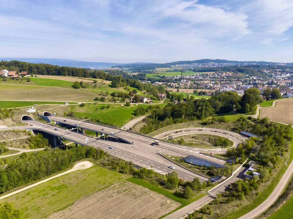 Drone image of the A3 highway with the portals of the Hafnerberg tunnel (left) and the Aescher tunnel.