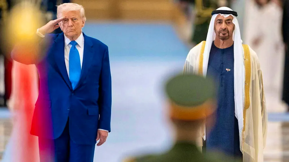 Donald Trump (left) visits the United Arab Emirates on May 15, 2025 and listens to the US anthem in the presence of Sheikh Muhammad bin Zayid Al Nahyan.