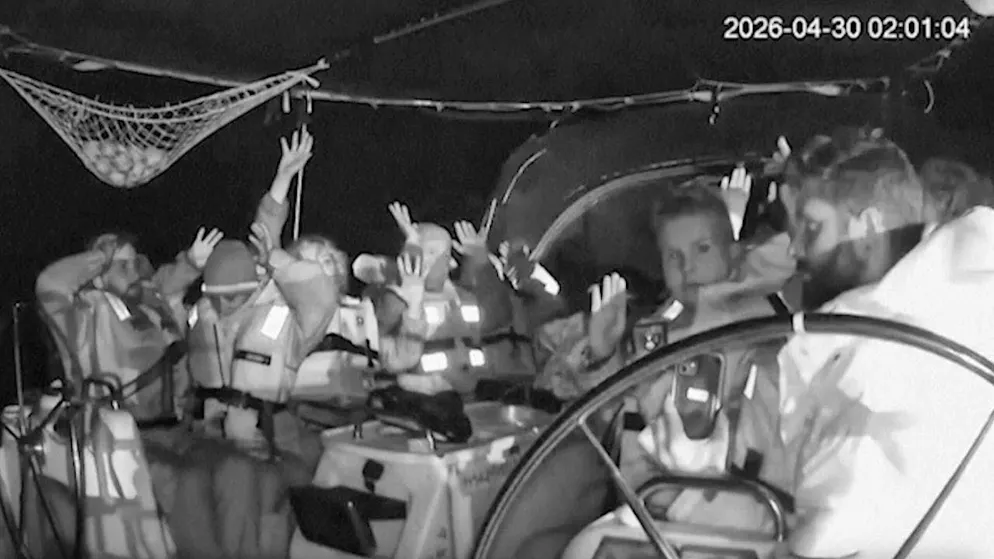 HANDOUT - This image from a surveillance camera released by the Global Sumud Flotilla via AP shows members of the Gaza aid flotilla with their hands in the air as Israeli forces intercept the activists' boats. Photo: Uncredited/Global Sumud Flotilla/AP/dpa (archive image)