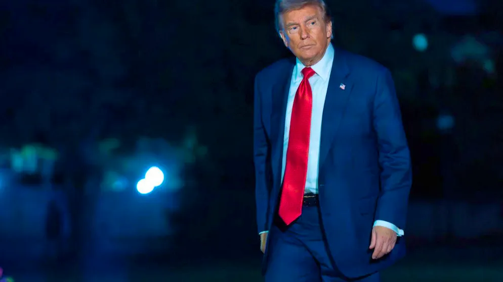 US President Donald Trump walks on the South Lawn upon his arrival at the White House. Photo: Jose Luis Magana/AP/dpa