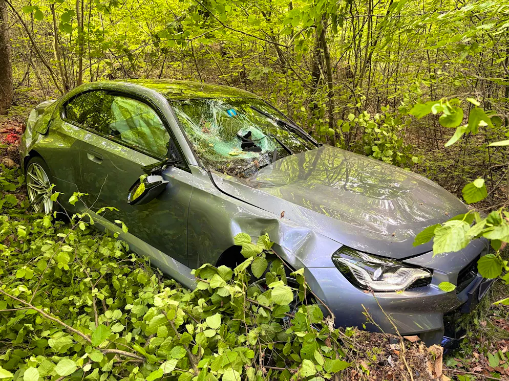 The car plunged several meters down a steep embankment.