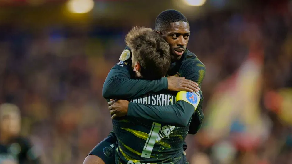 PSG captain Ousmane Dembélé hugs team-mate and scorer of the winning goal Chwitscha Kwarazchelia