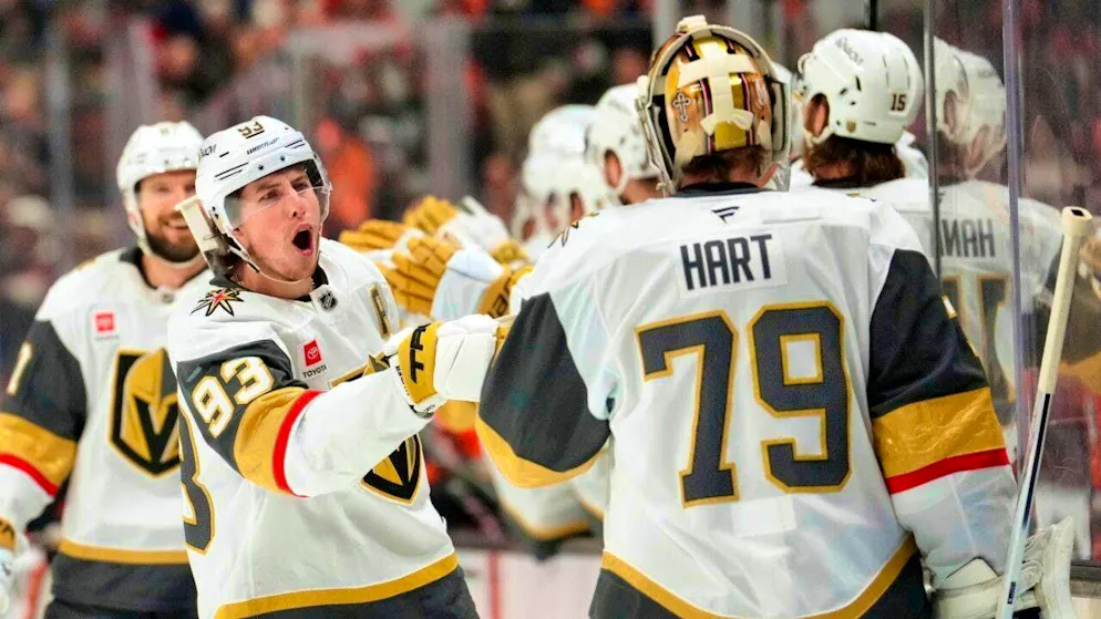 Vegas Golden Knights' Carter Hart, Akira Schmid's teammate and rival, celebrates with his teammates as they advance to the semifinals of the NHL playoffs