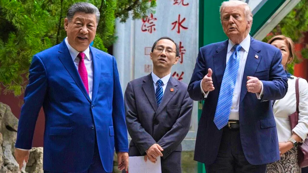 US President Donald Trump walks with China's President Xi Jinping on the grounds of the Zhongnanhai building complex.