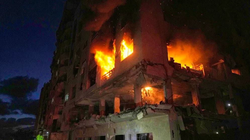Burning building after an Israeli attack in Gaza City. Photo: Jehad Alshrafi/AP/dpa