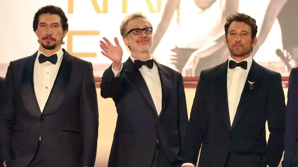 PAPER TIGER. Adam Driver, director James Gray and Miles Teller at the world premiere in Cannes