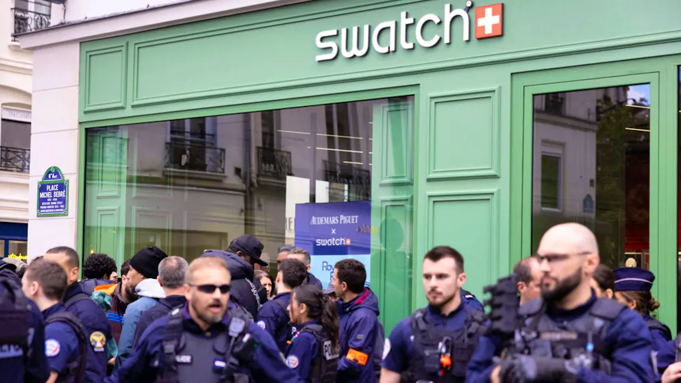 Police in front of a Swatch store in Paris on Saturday.
