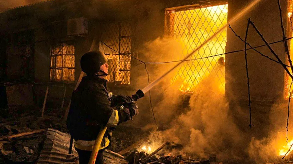 ARCHIVE - Firefighters extinguish a fire in a building after a Russian drone attack in the Odessa region. Photo: Uncredited/Ukrainian Emergency Service/dpa