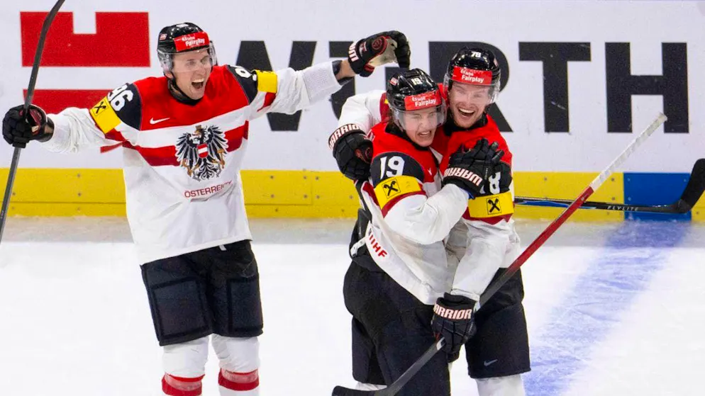 ZSC forward Vinzenz Rohrer (center) lets his emotions run free after his goal for the 3:1 final score