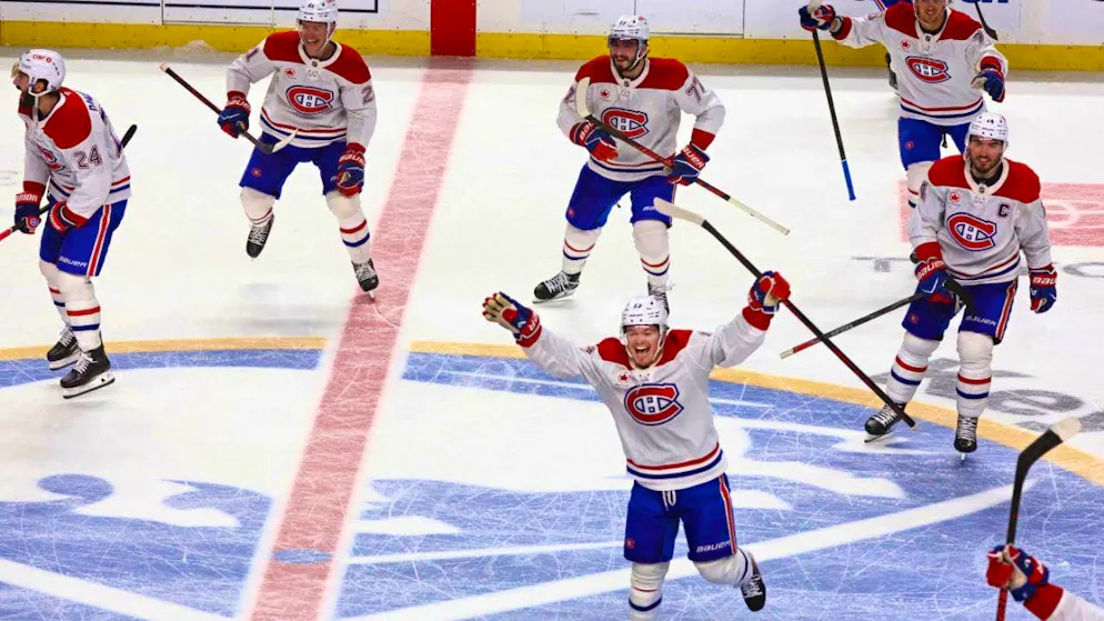 Canadiens players celebrate the overtime goal that sends them to the NHL semifinals