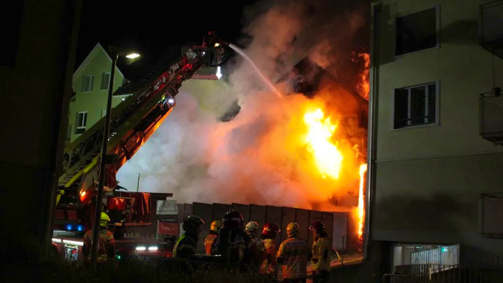The fire department found an apartment building on fire.