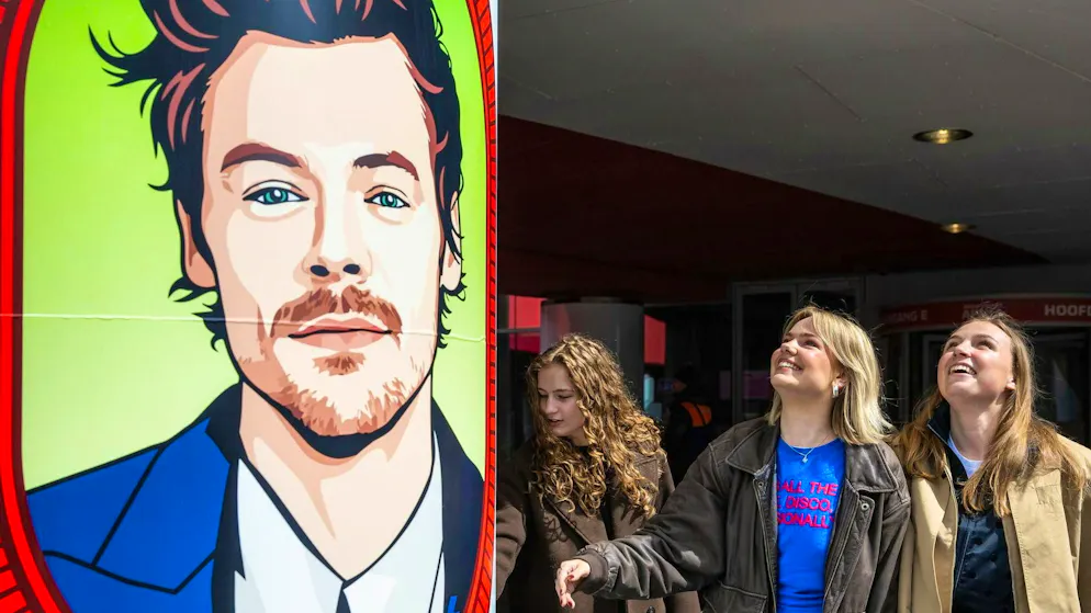 Fans in front of a portrait of the pop star outside the Johan Cruijff Arena in Amsterdam.