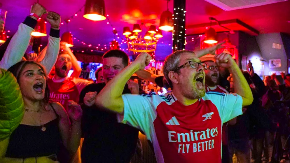 Huge celebrations in north London: Arsenal fans celebrate the club's first league title since 2004