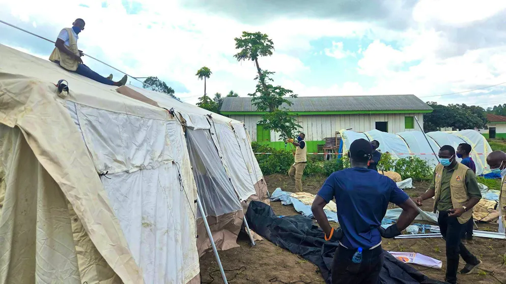 Aid workers set up an Ebola treatment center in Bunia, Congo.