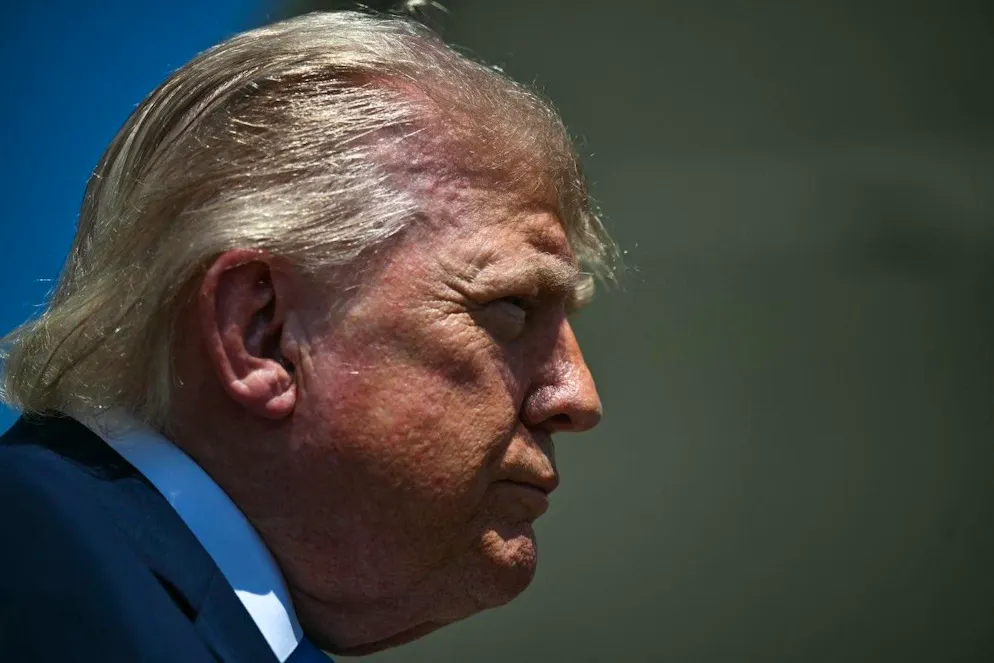 US President Donald Trump speaks to reporters after stepping off Air Force One at Joint Base Andrews, Maryland on May 20, 2026, as he returns to Washington, DC, after delivering the commmencement address to the US Coast Guard Academy's 2026 graduating class. President Trump said that it was a "very big moment" on Wednesday after the Justice Department indicted 94-year-old former Cuban president Raul Castro over the 1996 downing of civilian planes manned by critics of the communist state (also known as the "Brothers to the Rescue" murders). (Photo by Kent NISHIMURA / AFP)