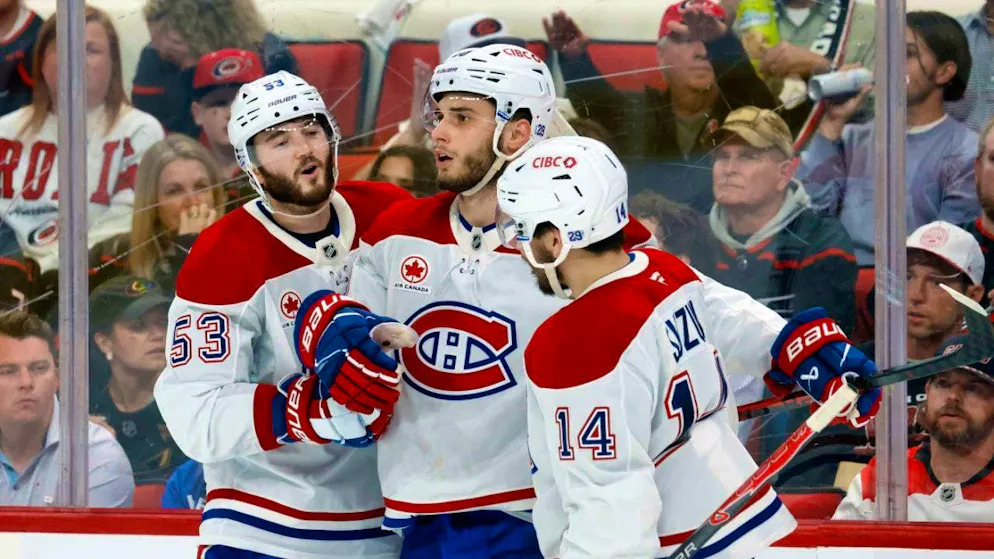 Montreal's Juraj Slafkovsky (center) celebrates his goal in the final period to make it 5-2 against the Hurricanes