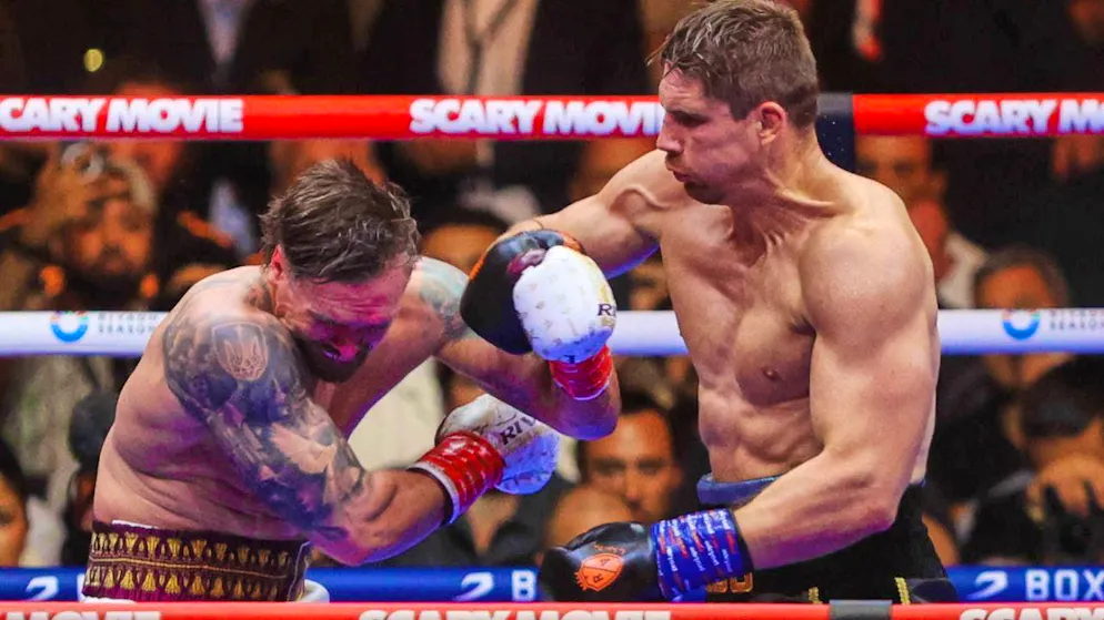 Alexander Usyk (left) takes a beating against kickboxer Rico Verhoeven