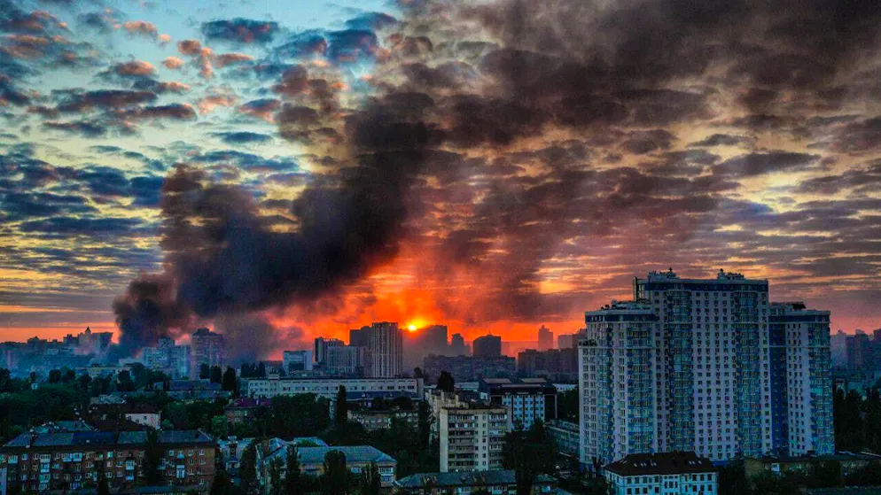 Smoke rises over the city at sunrise after a massive Russian airstrike. Photo: Zoya Shu/AP/dpa