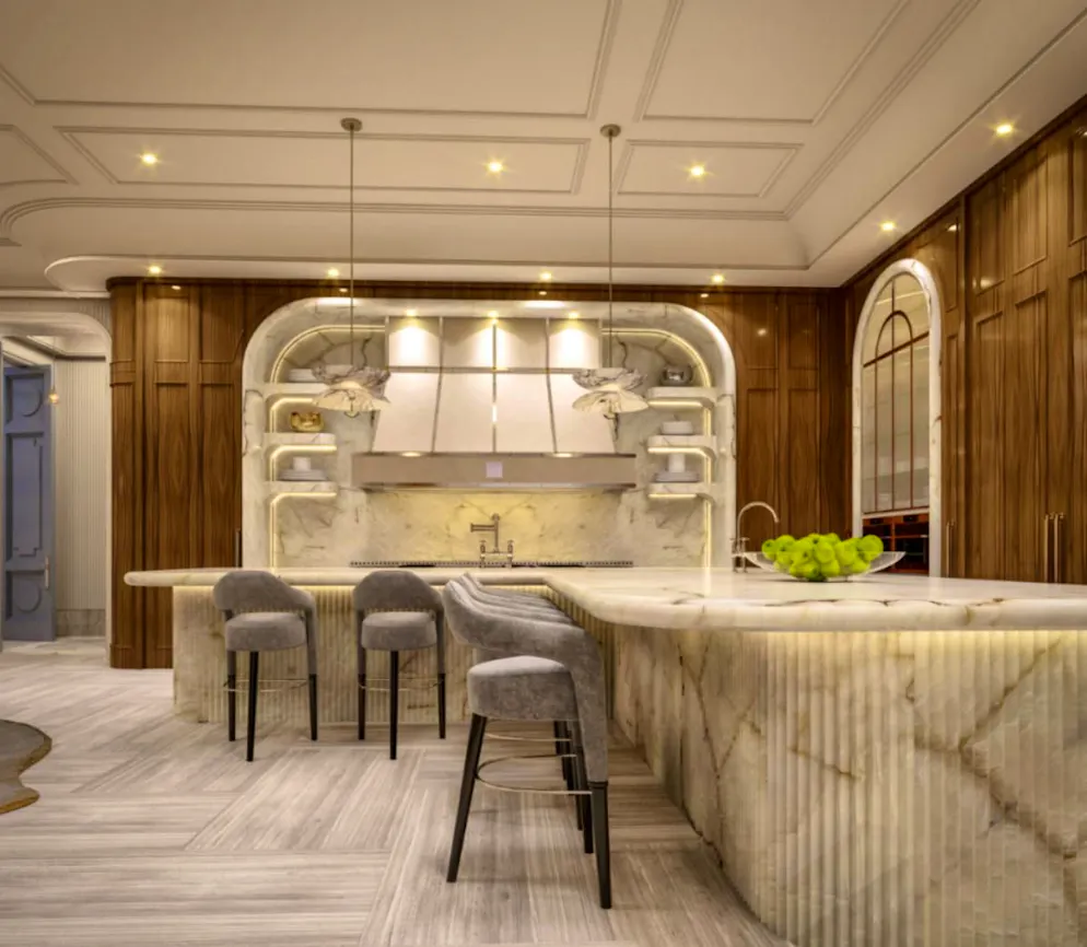 Mark Zuckerberg mega-mansion. The kitchen with an L-shaped marble island with fluted details.