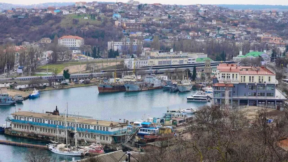 ARCHIVE - From a plateau in the port city, there is a clear view of a bay where ships are parked and the train station (r) can also be seen. There have been massive Ukrainian drone attacks in Sevastopol on the Russian-occupied Crimean peninsula. Photo: Ulf Mauder/dpa