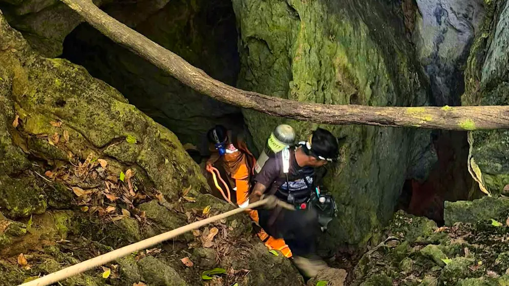 Rescuers work their way to the trapped gold seekers on Tuesday.