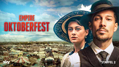 Key Art zu Empire Oktoberfest Staffel 2 mit zwei Hauptfiguren vor einem historischen Festgelände.