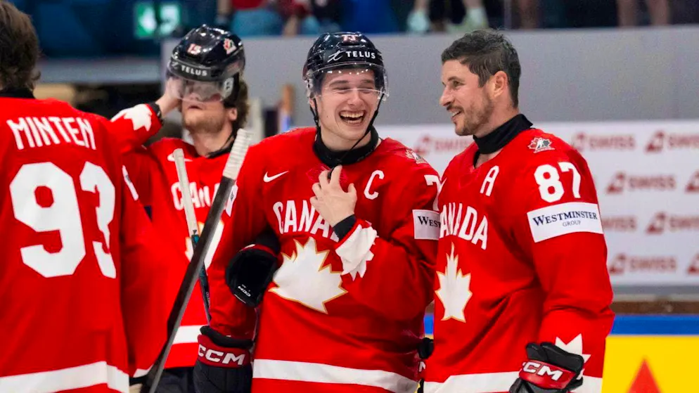 The two Canadian superstars in conversation: Captain Macklin Celebrini (second from right) and Sidney Crosby (right)