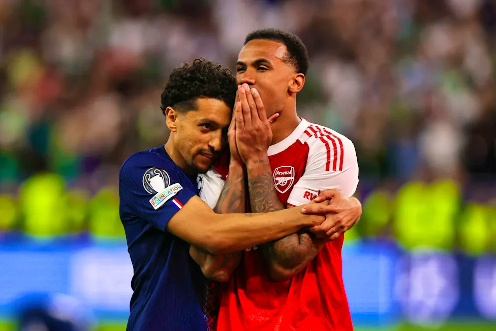 PSG captain Marquinhos consoles his Brazilian compatriot Gabriel Magalhaes, who misses the all-important penalty.