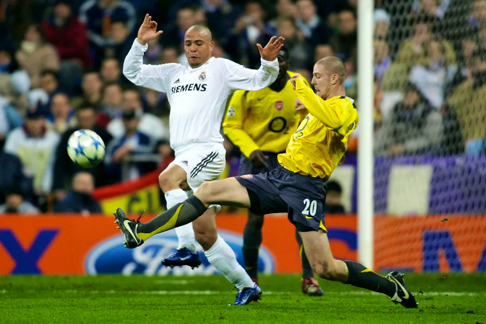 Senderos in a duel with Real Madrid's Ronaldo in 2006.