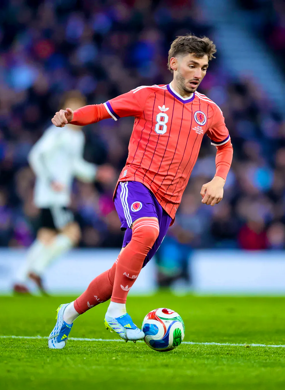 These are the jerseys of the World Cup participants. Billy Gilmour in Scotland's away kit.