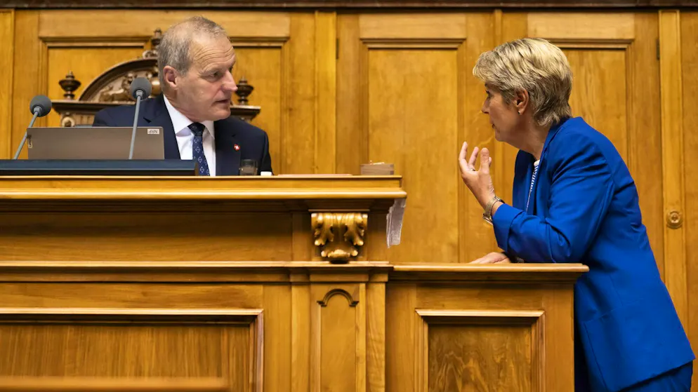 Federal Councilor Karin Keller-Sutter (right) with National Council President Pierre-Andre Page, SVP-FR, on Tuesday during the summer session of the Federal Assembly.