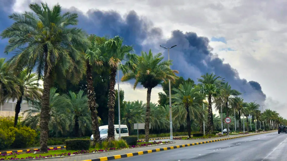 Smoke over the airport in Kuwait City after a drone attack on a fuel depot. (March 25, 2026)