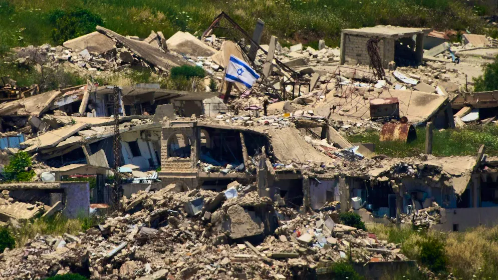An Israeli flag flies over a destroyed building in southern Lebanon. (June 4, 2026)