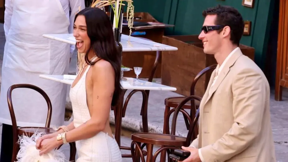 Because of mega wedding. Dua Lipa is said to have paid residents in Palermo over 5,000 francs in compensation