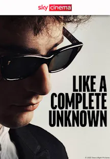 Filmposter zu «Like a Complete Unknown» mit einem Mann in Sonnenbrille in Nahaufnahme.