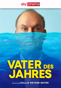 Mann im Anzug schaut aus einer blauen Wasseroberfläche für den Film Vater des Jahres